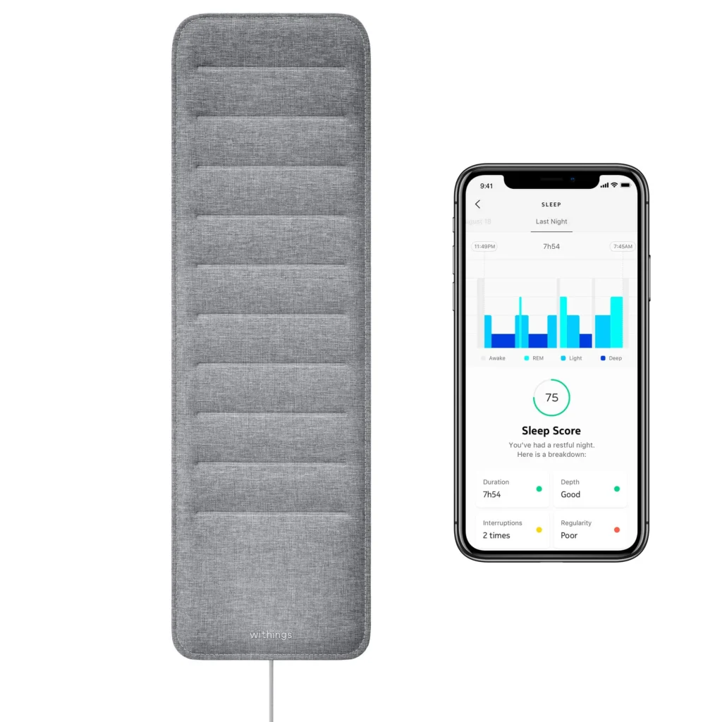 Under-mattress sleep tracking pad connected to a smartphone app displaying sleep stages, duration, interruptions, and overall sleep score.