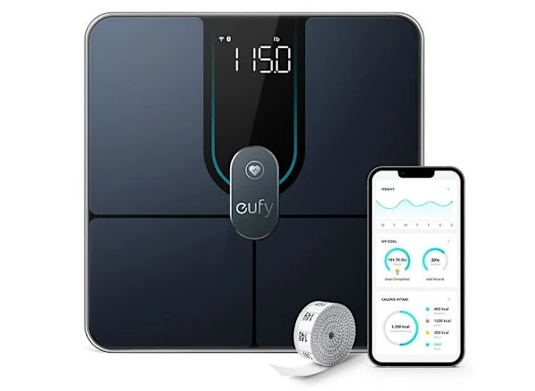 Eufy Smart Scale P2 Pro black glass body composition scale displayed with smartphone app dashboard and measuring tape.
